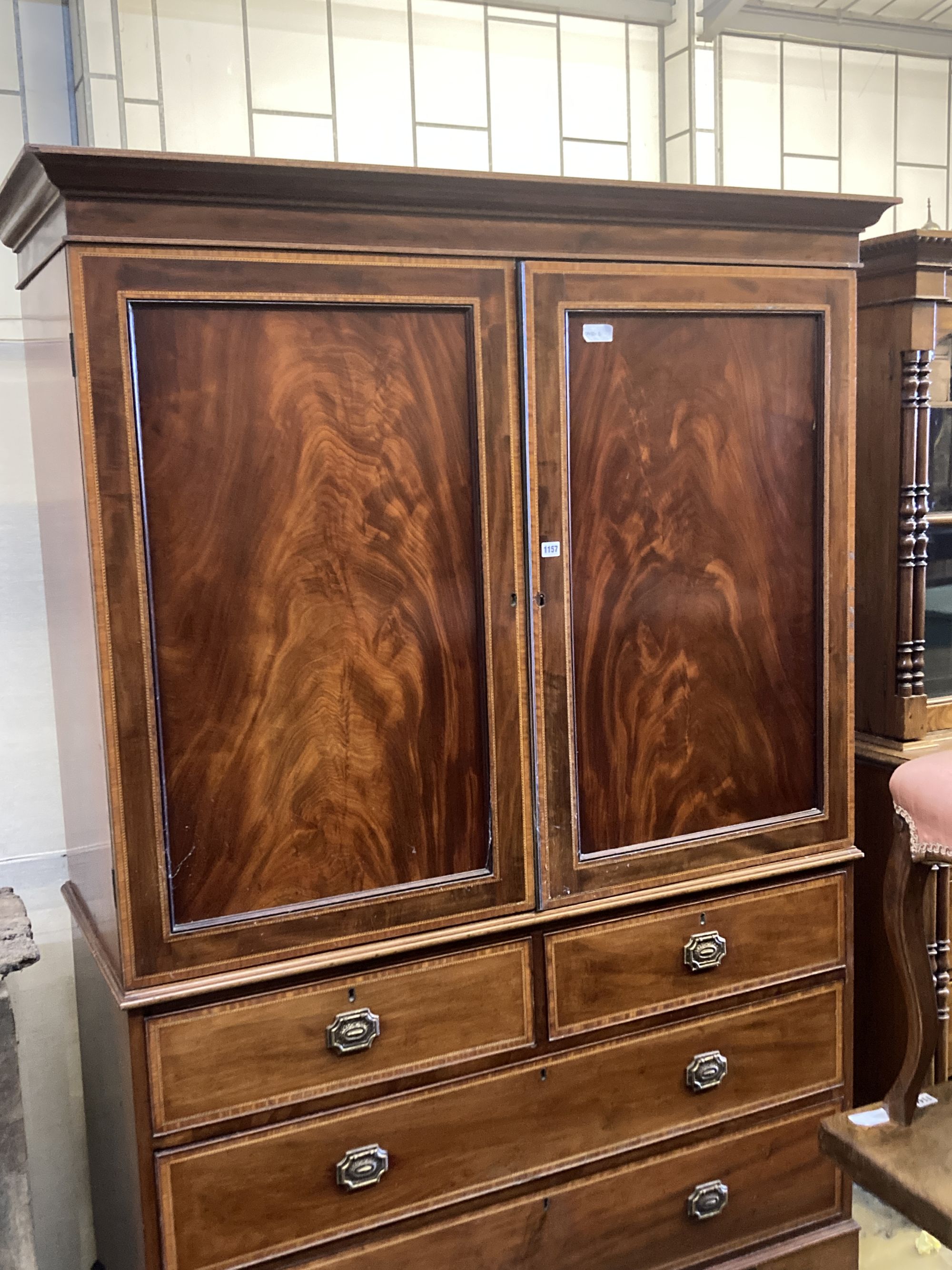 A George III style satinwood banded mahogany linen press, length 136cm, depth 59cm, height 200cm